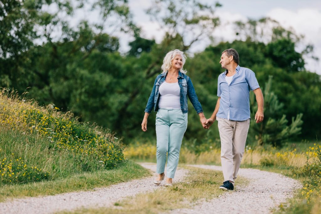 Elderly couple walking on the path.